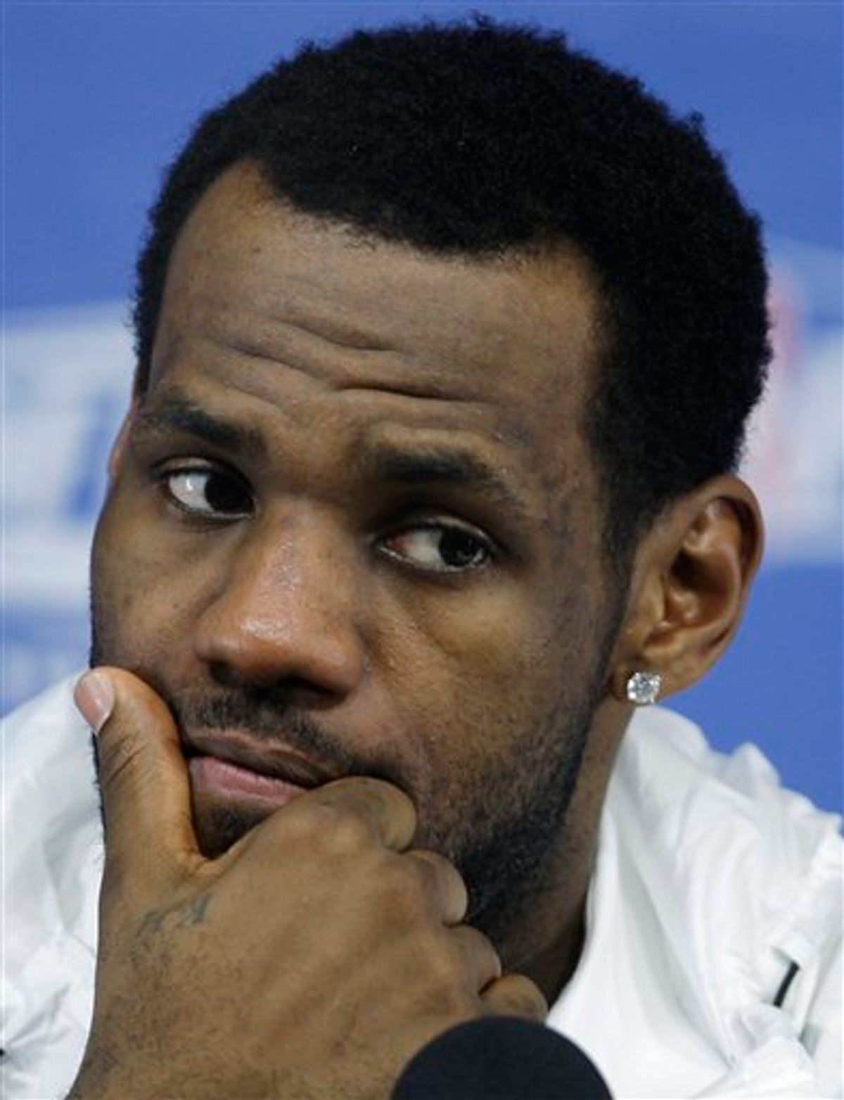Cleveland Cavaliers forward LeBron James listens to a question during a news conference after losing 94-85 to the Boston Celtics in Game 6 of an NBA basketball second-round playoff series, Thursday, May 13, 2010, in Boston.  With no title again for Cleveland this year, James will have to decide if it's time to go look for it elsewhere.(AP Photo/Charles Krupa)    (AP)