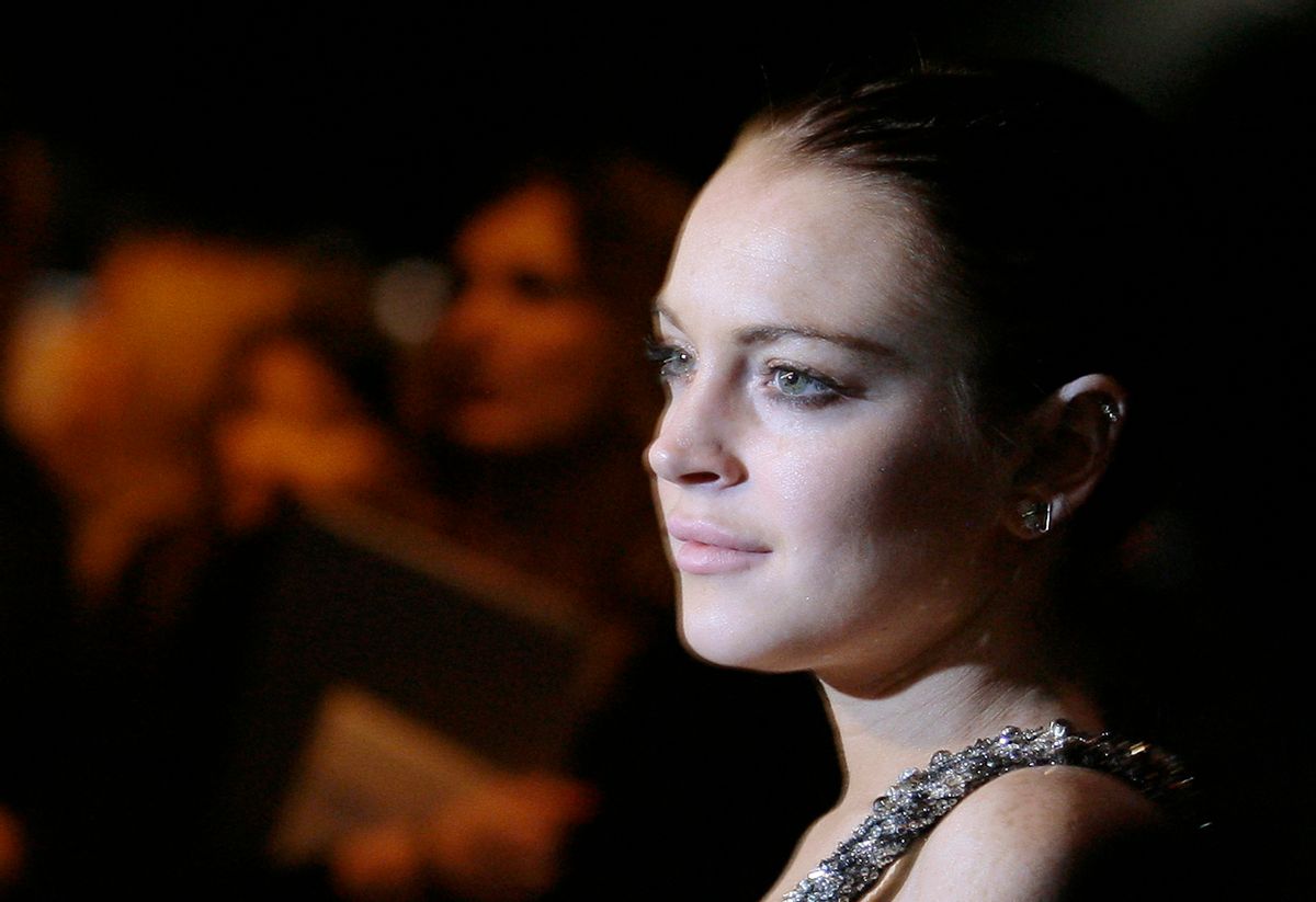 U.S. actress Lindsay Lohan poses for photographers before attending the Roberto Cavalli Fall/Winter 2010/11 Women's collection show during Milan Fashion Week February 28, 2010. REUTERS/Alessandro Garofalo (ITALY - Tags: FASHION ENTERTAINMENT)       (Reuters)