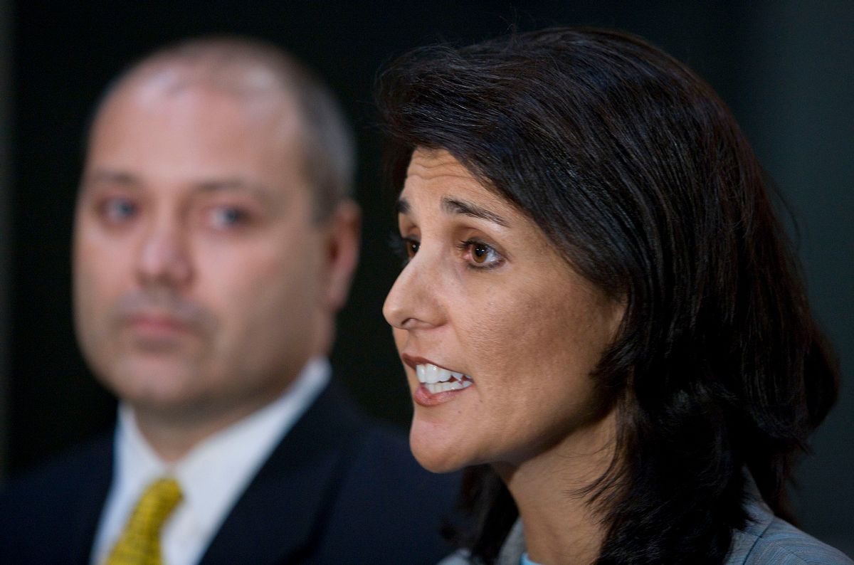 South Carolina state Rep. Nikki Haley, right, is joined by her husband Michael Haley in Greenville, S.C., Monday, May 24, 2010, as she denies current allegations surrounding an affair with her and blogger Will Folks. Mrs. Haley had been speaking at a forum at the Carolina First Center. (AP Photo/Patrick Collard)  (Associated Press)
