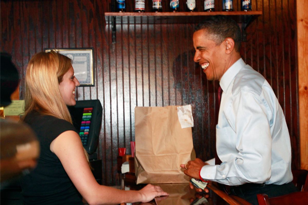 President Obama pays for his food order at Duff's Famous Wings Restaurant in Buffalo on Thursday.
