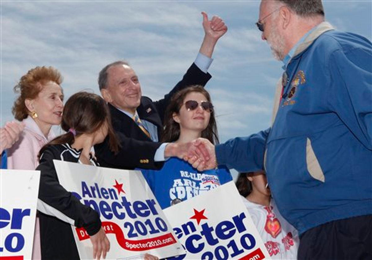 U.S. Sen. Arlen Specter, D-Pa., shakes hands with Danny Grace, right, Secretary-Treasurer of Local 830, during the Delivering for Pennsylvania: Upgrading the Port of Philadelphia campaign rally at the Packer Avenue Marine Terminal, Saturday, May 15, 2010, in Philadelphia. With Specter on stage from left are his wife Joan Specter, and granddaughters Lilli Specter and Silvi Specter. (AP Photo/Carolyn Kaster) (AP)