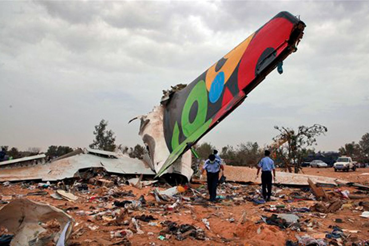 Rescue teams search the site of the Afriqiyah Airways plane crash in Tripoli, Libya.  