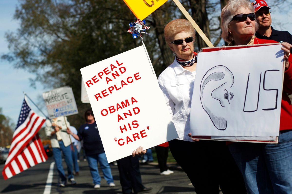 Tea Party activists demonstrate during a tax day rally outside the Korean War Memorial in Hauppauge, New York April 15, 2010.  REUTERS/Shannon Stapleton   (UNITED STATES - Tags: BUSINESS CIVIL UNREST POLITICS)   (Reuters)