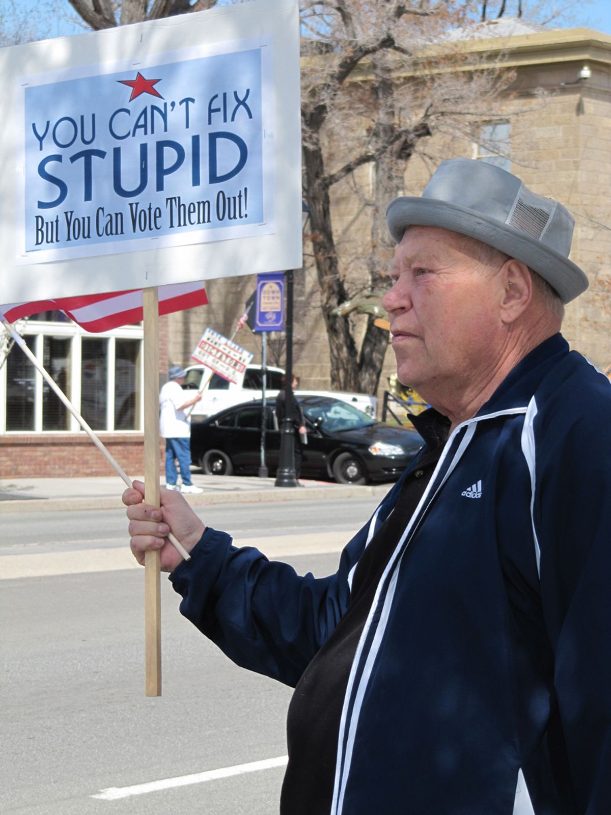 Warren Jensen holds a sign along  U.S. 395 during a tea party rally and tax protest on the Capitol grounds in Carson City, Nev., Thursday, April 15, 2010. The 73-year-old Jensen says he's new to political activism, but became involved because he's angry over government.  (AP Photo/Sandra Chereb)    (Sandra Chereb)