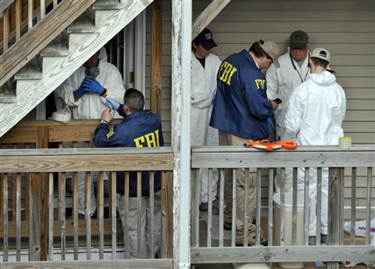 FBI search a house where Faisal Shahzad lived in Bridgeport, Conn., Tuesday, May 4, 2010.  Shahzad was taken into custody late Monday by FBI agents and New York Police Department detectives while trying to leave the country.  (AP Photo/Jessica Hill) (AP)