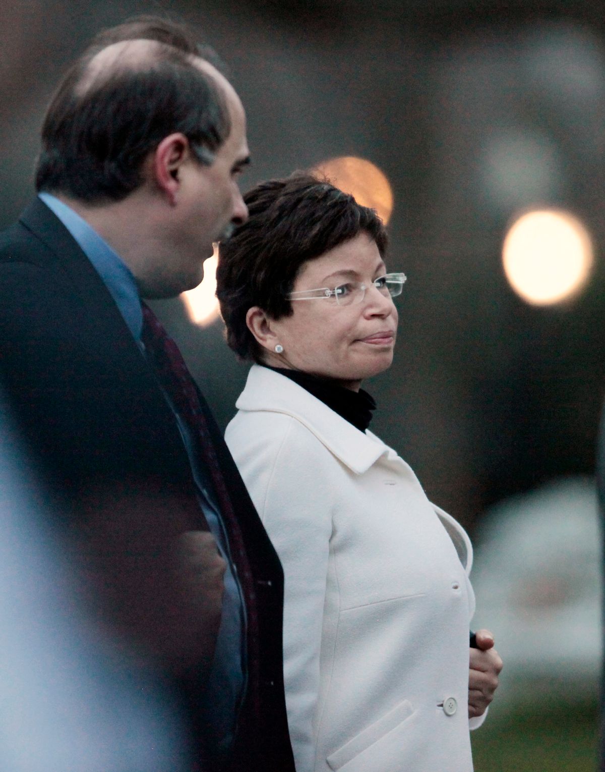 Senior advisers Valerie Jarrett and David Axelrod walk together on the South Lawn as President Barack Obama returns to the White House in Washington, Friday, Dec. 4, 2009, after he returned from a trip to Allentown, Pa., where he spoke about jobs. (AP Photo/Charles Dharapak) (Associated Press)