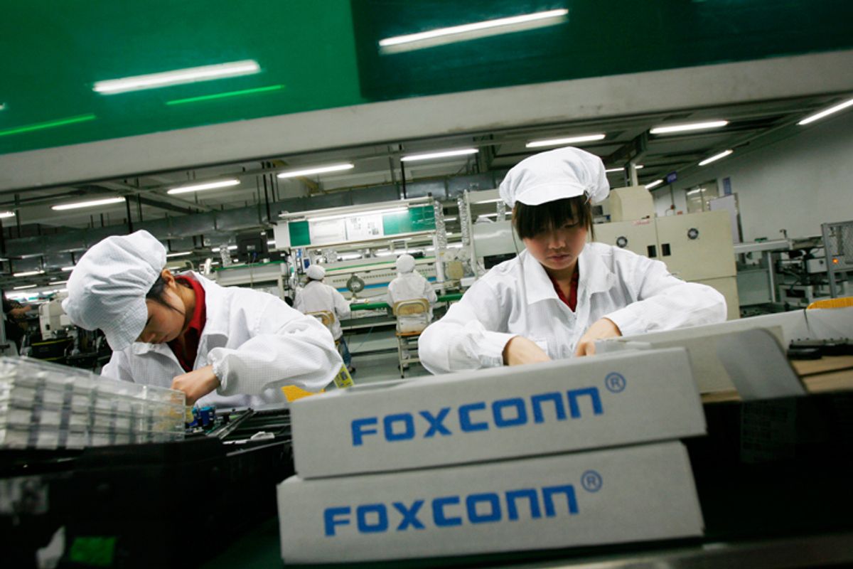 Workers at a Foxconn factory in Longhua in the southern Guangdong province on May 26.