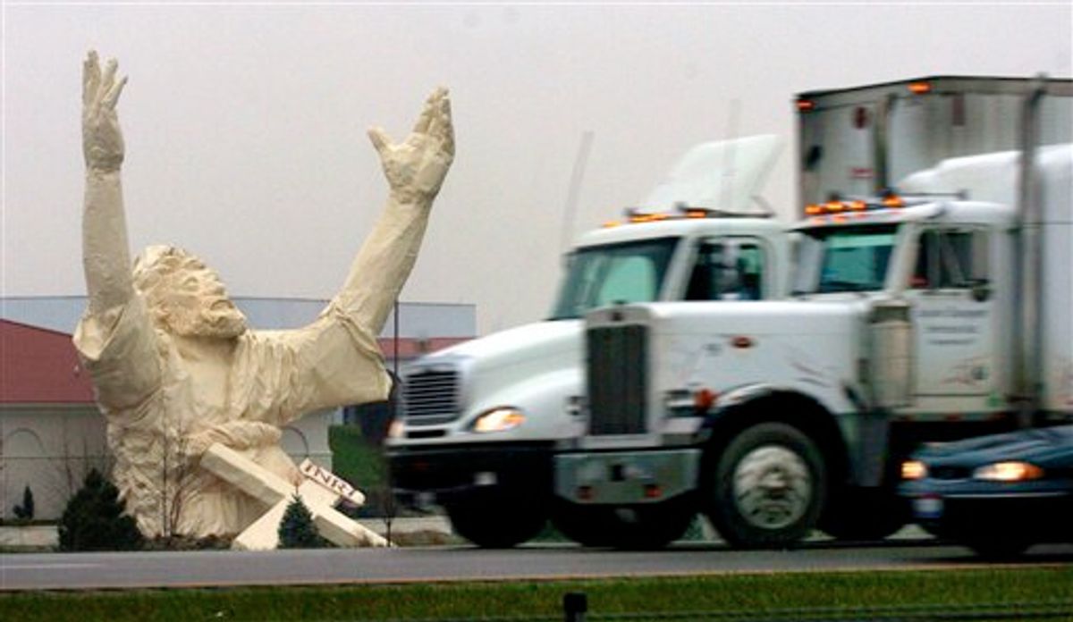FILE -- A Nov. 17, 2004 file photo shows traffic on I-75 just north of the Monroe, Ohio, going by  a six story high statue of Jesus  under construction at the Solid Rock Church  Nov. 17, 2004.  The 62-foot-tall statue made of plastic foam and fiberglass over a steel frame was stuck by lightning and destroyed Monday June 14, 2010. (AP Photo/The Enquirer, Glenn Hartong/file)  -- Mandatory Credit -- (AP)