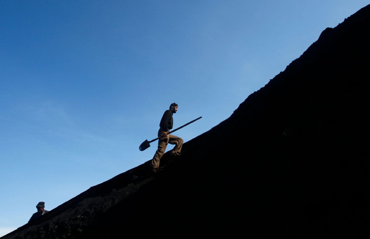 An Afghan miner works at the Karkar coal mine in Pul-i-Kumri, about 170km north of Kabul, March 8, 2009. The Karkar mine, which hires 280 workers, produces about 100 tonnes of coal a day. The salary for a miner ranges from $70 to $110 per month.  REUTERS/Ahmad Masood (AFGHANISTAN ENVIRONMENT BUSINESS SOCIETY ENERGY) (Â© Ahmad Masood / Reuters)