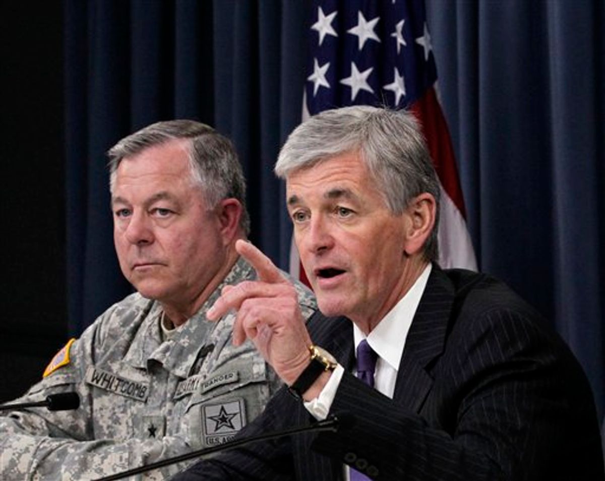 Army Secretary John McHugh, right, accompanied by Lt. Gen. R. Steven Whitcomb, gestures during a news conference at the Pentagon, Thursday, June 10, 2010, to discuss an investigation at Arlington National Cemetery. Whitcomb, the Army's inspector general conducted the investigation.  (AP Photo/J. Scott Applewhite) (AP)