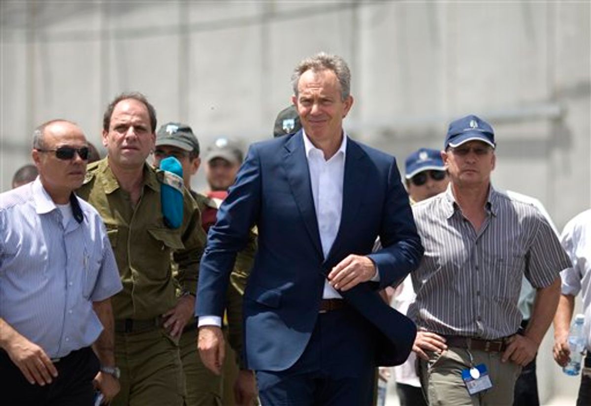 International Mideast envoy Tony Blair, center, visits the Kerem Shalom crossing, between Israel and the Gaza Strip, southern Israel, Tuesday, June 22, 2010. Israel announced Sunday an easement of its blockade on the Gaza strip saying it will allow almost all items into Gaza, except for weapons or weapons-related materials that could boost the area's militant Hamas rulers. Previously, Israel had issued only a narrow list of items to enter Gaza. (AP Photo/Ariel Schalit) (AP)