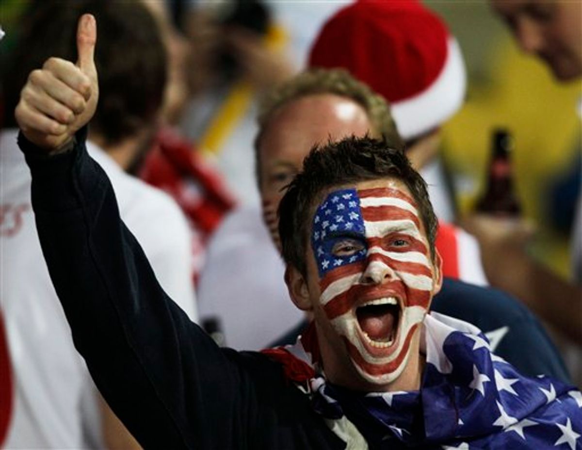 A United States fan cheers before the World Cup group C soccer match between England and the United States at Royal Bafokeng Stadium in Rustenburg, South Africa, Saturday, June 12, 2010.  (AP Photo/Elise Amendola) (AP)