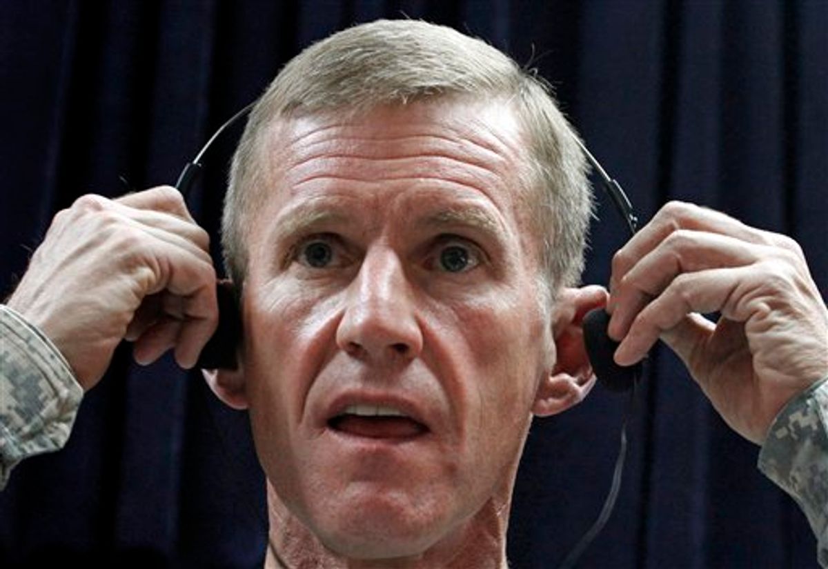 U.S. Gen. Stanley McChrystal,  the commander of the NATO and U.S. forces in Afghanistan, adjusts his headphone during a press conference in Kabul, Afghanistan on Sunday, May 30, 2010. Gen. McChrystal stressed Sunday that progress toward real stability in Afghanistan will be slow as international troops painstakingly try to win over a population that includes its enemies and has little trust in the government. (AP Photo/Musadeq Sadeq) (AP)