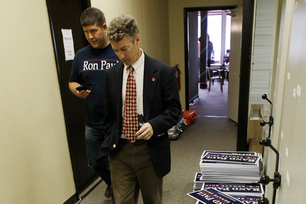 Rand Paul, walks down a hallway at his campaign headquarters in Bowling Green, Ky.