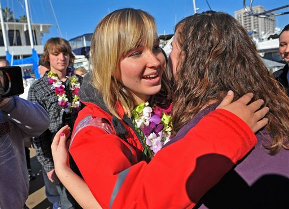 File - In this Jan. 23, 2010 file photo Abby Sunderland, left, 16,  gets a hug from friend Casey Nash, right, before leaving for her world record attempting solo journey around the world from the Del Rey Yacht Club in Marina del Rey, Calif. Rescuers searched Thursday, June 10, 2010 for her somewhere between Africa and Australia. The family spokesperson says emergency beacons were activated overnight and there has been a loss of communication. She was feared in trouble in the southern Indian Ocean. (AP Photo/Richard Hartog) (AP)
