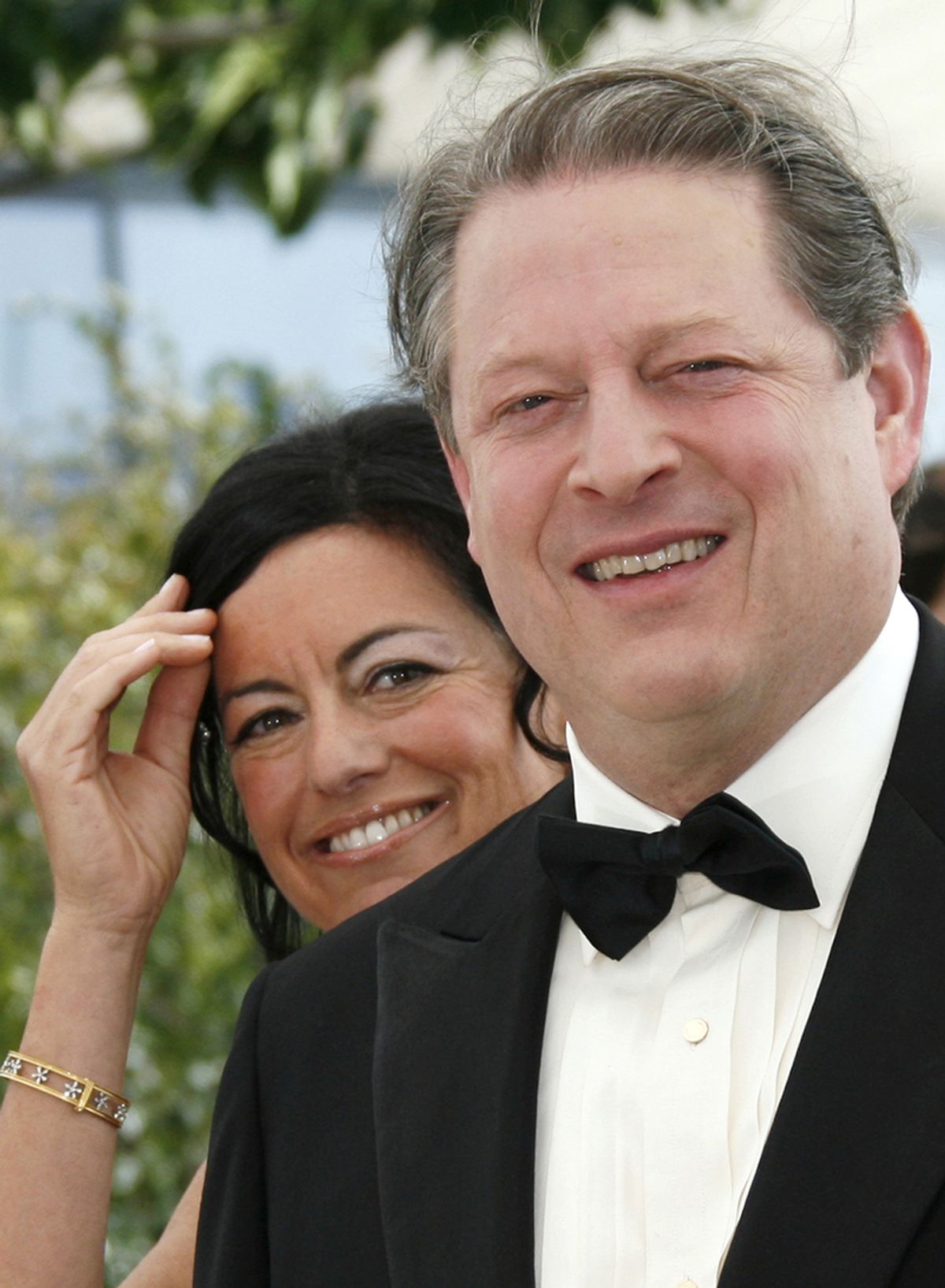 Former U.S. Vice President Al Gore (R) poses with producer Laurie David during a photocall for [U.S. director Davis Guggenheim's] film 'An Inconvenient Truth' at the 59th Cannes Film Festival May 20, 2006. (Â© John Schults / Reuters)