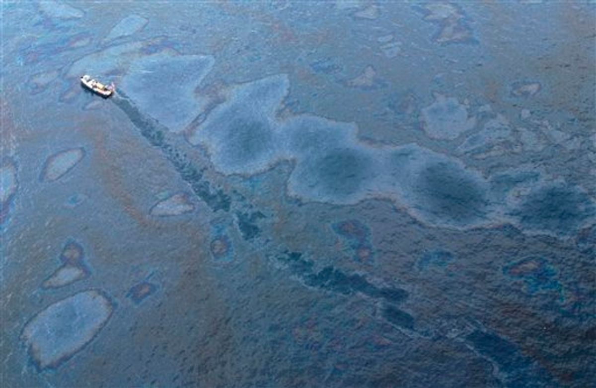 A supply vessel passes through an oil sheen near the site of the Deepwater Horizon oil spill in the Gulf of Mexico near the coast of Louisiana, Monday, May 31, 2010. (AP Photo/Jae C. Hong) (AP)