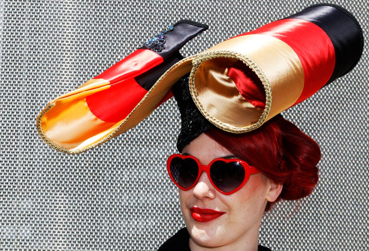A racegoer poses in her hat on the first day of horse racing at Royal Ascot in southern England June 15, 2010.   REUTERS/Luke MacGregor (BRITAIN - Tags: SPORT HORSE RACING EQUESTRIANISM SOCIETY) (Â© Luke Macgregor / Reuters)