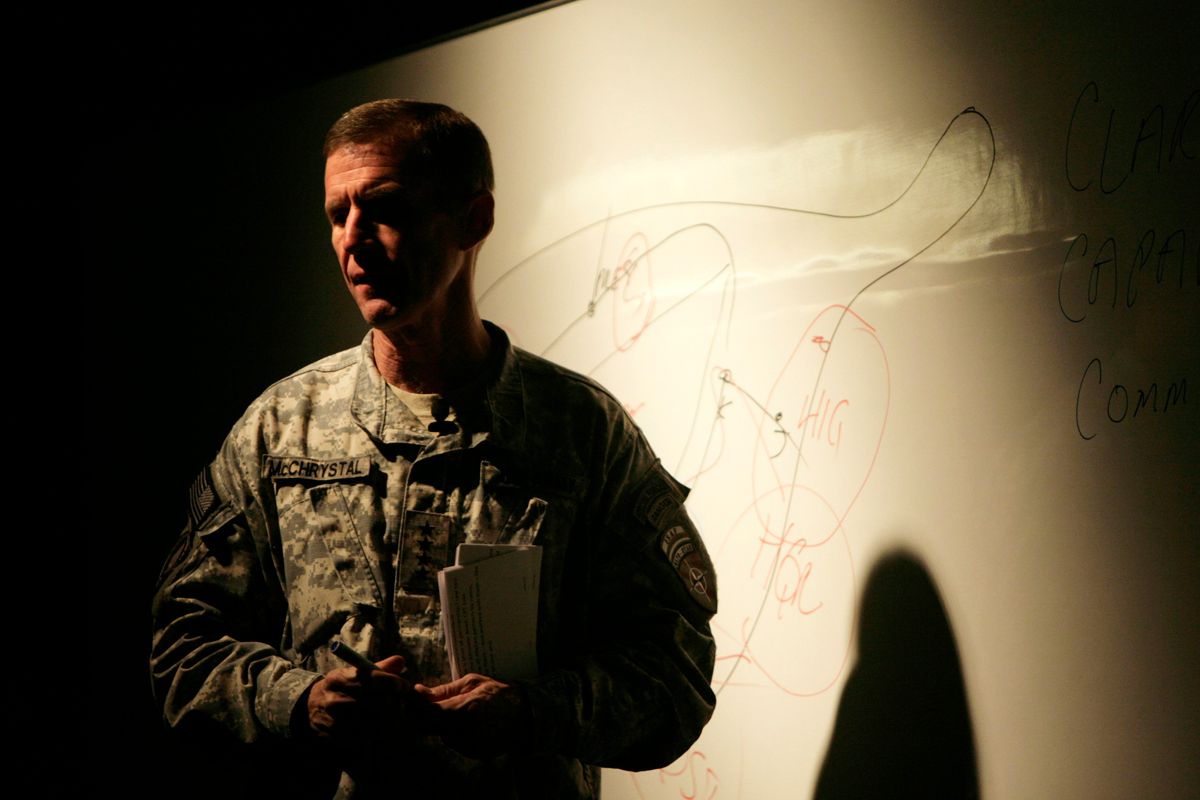 The top U.S. and NATO commander in Afghanistan, General Stanley McChrystal speaks to the military at US base Kandahar Airfield, Kandahar, Afghanistan, December 2, 2009. The first of 30,000 new U.S. troops will arrive in Afghanistan in two to three weeks, top U.S. officials said on Wednesday, even as they made clear plans to start bringing the soldiers home in 18 months could slip.  REUTERS/Mustafa Quraishi/Pool (AFGHANISTAN CONFLICT MILITARY POLITICS) (Â© Pool New / Reuters)