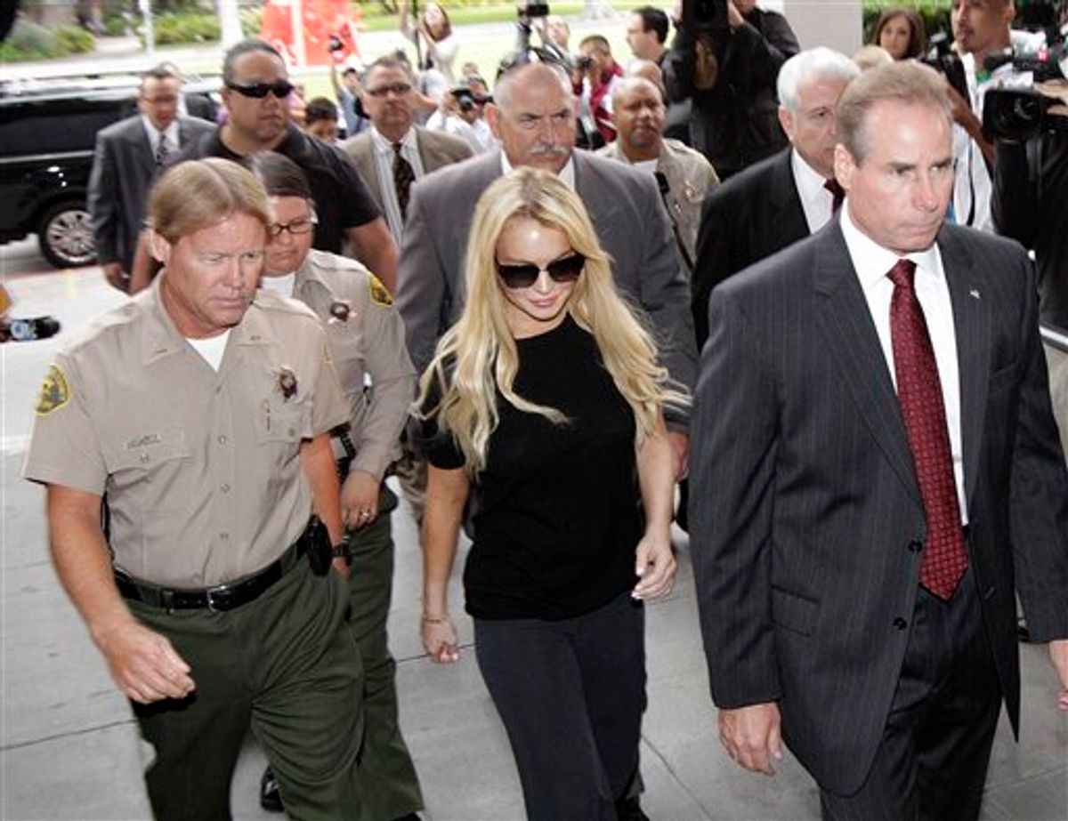 Actress Lindsay Lohan, center, arrives at Beverly Hills courthouse in Beverly Hills, Calif., Tuesday, July 6, 2010. (AP Photo/Jae C. Hong) (AP)