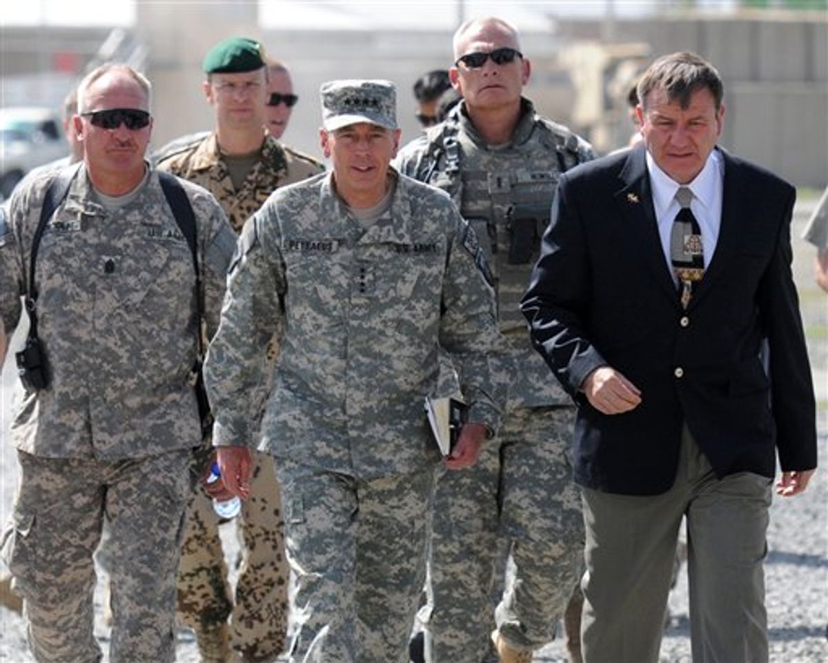 In this photo released by the U.S. Army, Gen. David Petraeus, International Security Assistance Force commander and U.S. Ambassador to Afghanistan Karl Eikenberry walk with other service members after arriving to Camp Phoenix in Kabul for a meeting, July 24, 2010. Petraeus and Eikenberry met with Vice Adm. Robert Harward, Deputy Commander of Detention Operations, Afghan Defense Minister Abdul Rahim Wardak and other officials to talk about the transition of authority of detainee operation centers throughout Afghanistan from U.S. forces to Afghan security forces. (AP Photo/U.S. Army, Sgt. Rebecca Linder)   (AP)