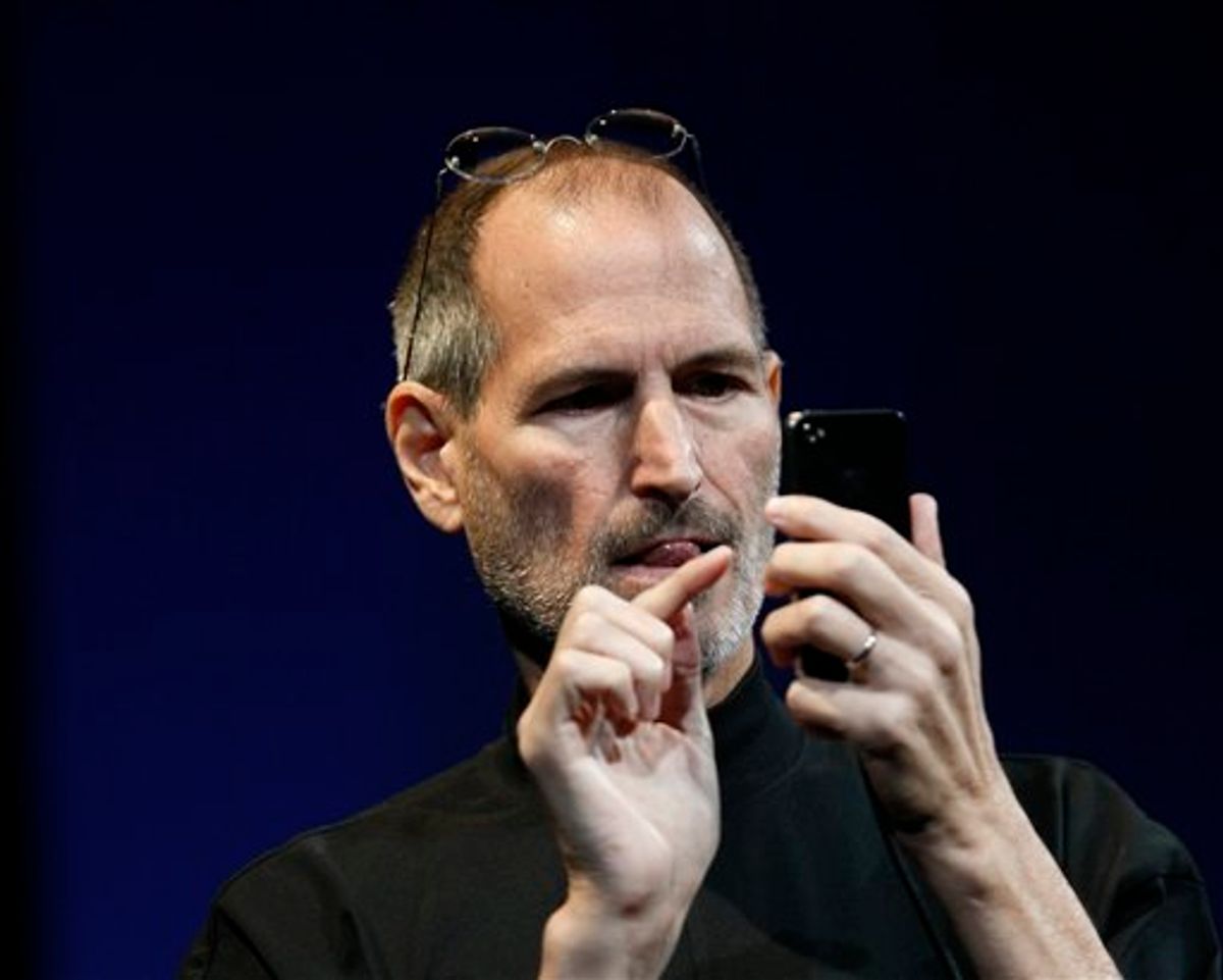 Apple CEO Steve Jobs uses the new iPhone during the Apple Worldwide Developers Conference, Monday, June 7, 2010, in San Francisco. (AP Photo/Paul Sakuma) (AP)
