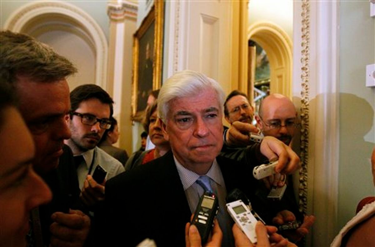 Senate Banking Committee Chairman Sen. Christopher Dodd, D-Conn., talks with the media on his way to the weekly caucus luncheon on Capitol Hill in Washington, Tuesday, July 13, 2010. (AP Photo/Alex Brandon) (AP)