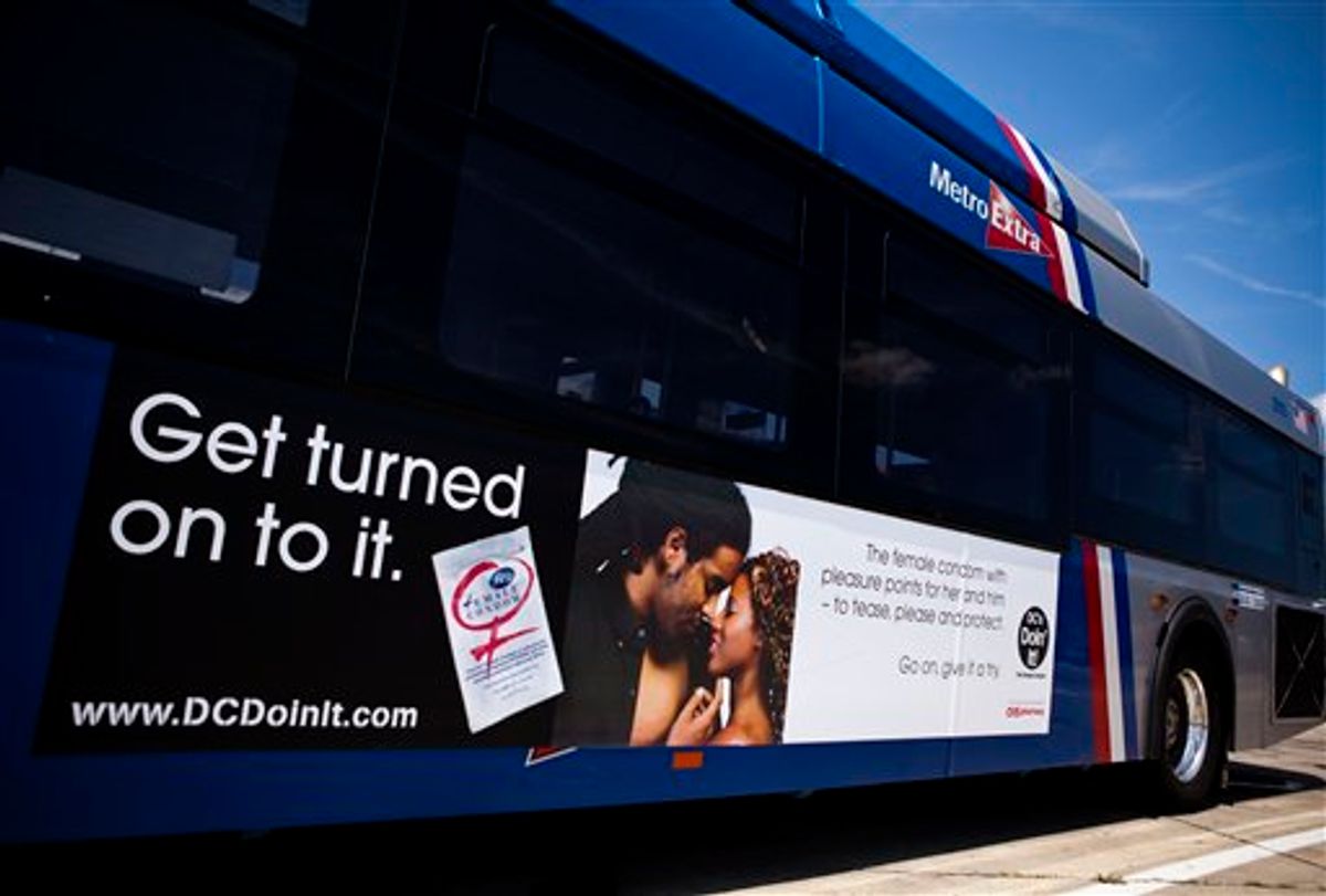 A Washington, D.C. Metro bus displays an advertisement for a female condom, in Washington, Monday, July 26, 2010. To encourage their use, community groups are handing out 500,000 of the female condoms, flexible pouches that are wider than a male condom but similar in length, during instruction sessions at beauty salons, barber shops, churches and restaurants. (AP Photo/Drew Angerer)    (AP)