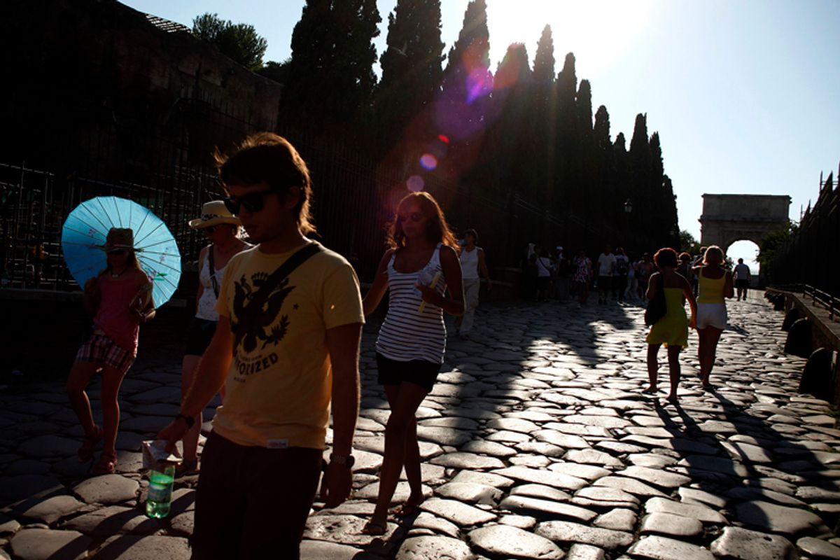 People walk in Rome's ancient Fori Imperiali during a hot summer day July 21, 2010. REUTERS/Alessia Pierdomenico (ITALY - Tags: ENVIRONMENT TRAVEL SOCIETY) (Â© Alessia Pierdomenico / Reuters)