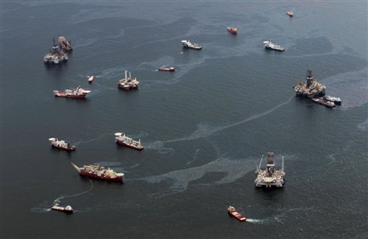 Drilling rigs and workboats operate at the site of the Deepwater Horizon incident in the Gulf of Mexico Friday, July 16, 2010. The wellhead has been capped and BP is continuing to test the integrity of the well before resuming production. (AP Photo/Dave Martin) (AP)