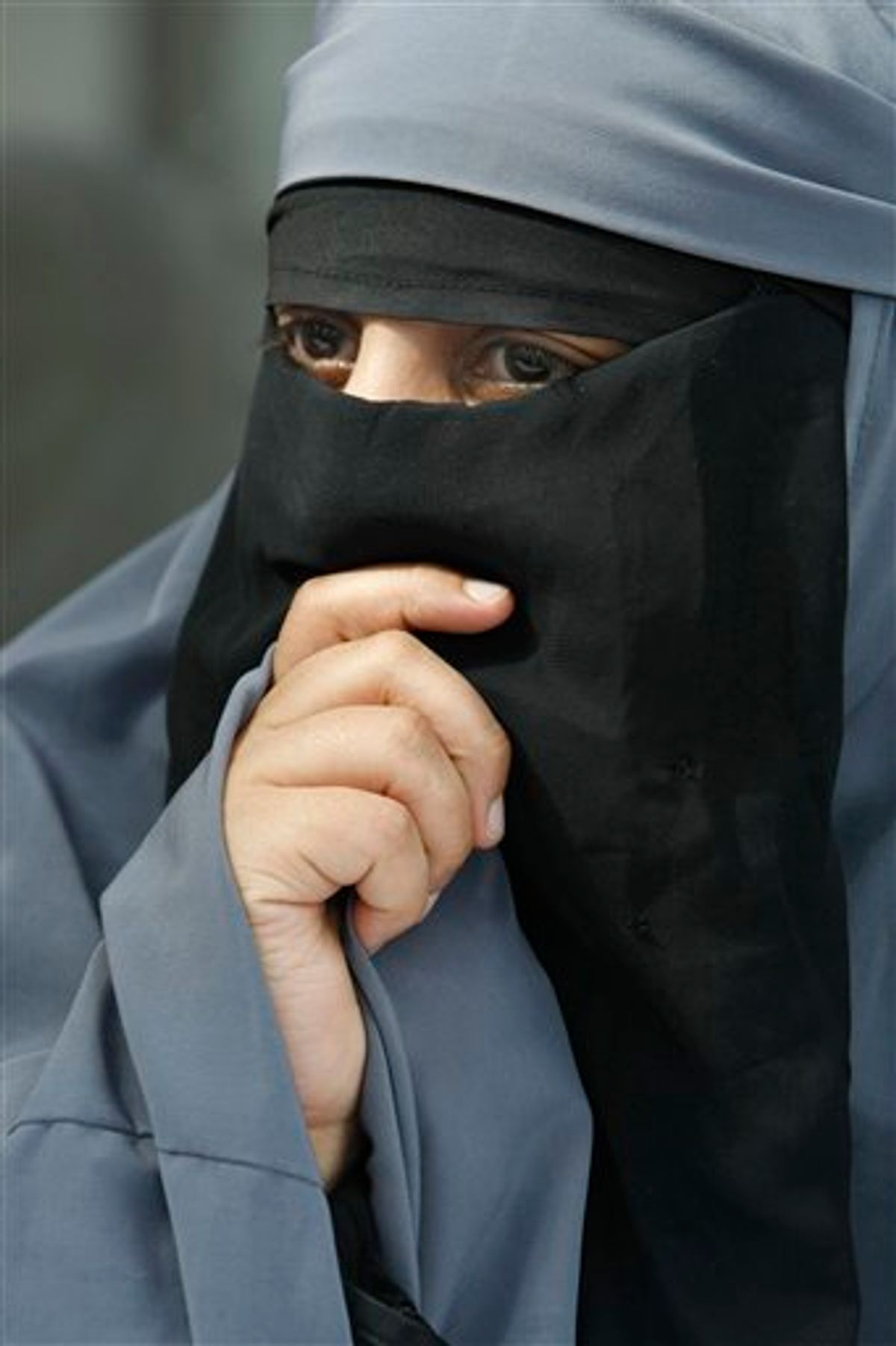 France's Kenza Drider, dressed in a niqab, speaks with reporters during a press conference in Montreuil, east of Paris, Tuesday May 18, 2010. The French government will examine Wednesday,  a proposed bill forbidding burqa-style Islamic veils that cover the face, on the grounds that they do not respect French values or women's dignity.(AP Photo/Remy de la Mauviniere) (AP)