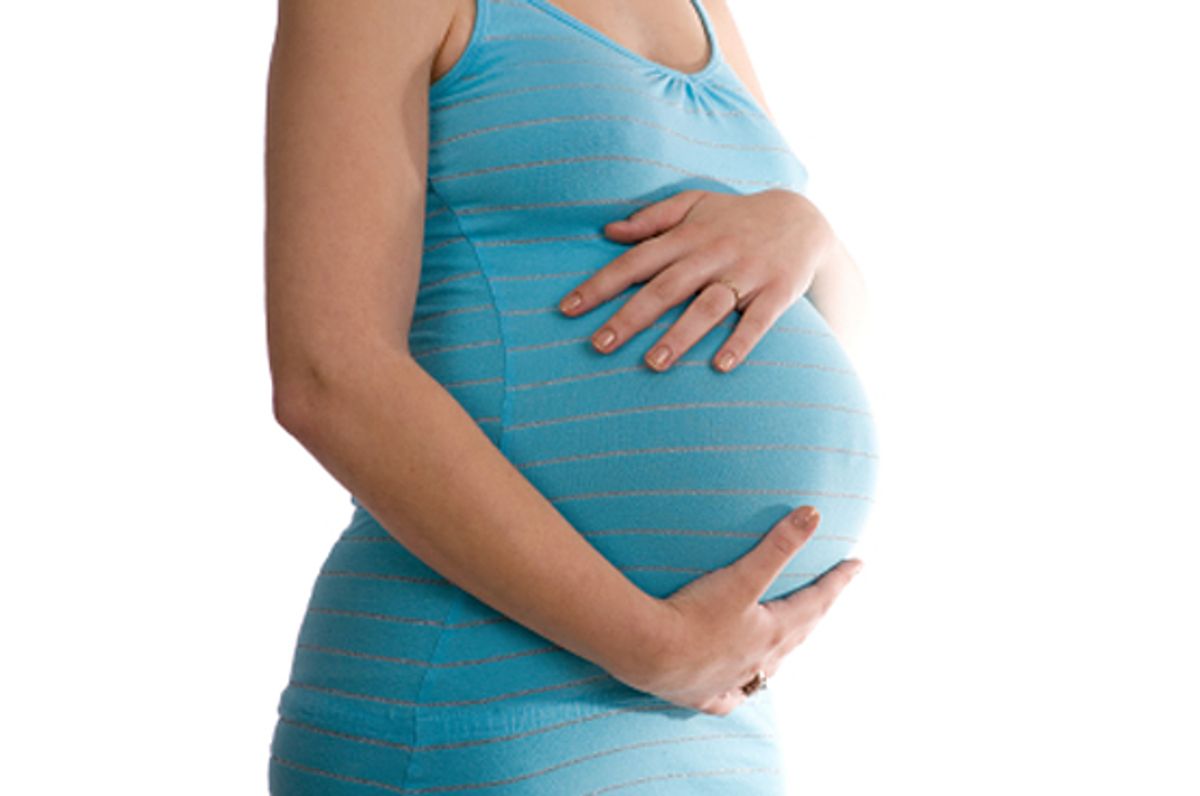 Pregnant belly isolated against white background (O.p. LantzendÃ¶rffer 3207ja Nl)