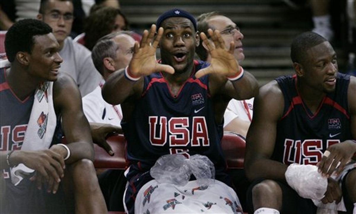 FILE - This Aug. 3, 2006, file photo shows LeBron James, center, of the United States joking around with teammates Chris Bosh, left, and Dwyane Wade during an exhibition basketball game against Puerto Rico,  in Las Vegas. Dwyane Wade wouldn't mind having LeBron James and Chris Bosh join him in Miami. If there's one team with the money to unite the three it's the Heat.  (AP Photo/Laura Rauch, File) (AP)