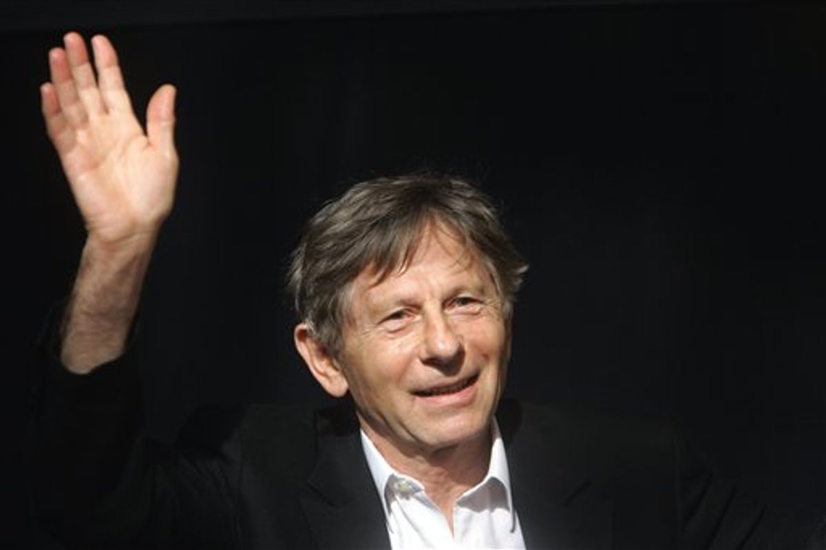 FILE - IN this  French-born film director Roman Polanski waves during a media presentation in Berlin. The Swiss government says it will make an announcement Monday July 12, 2010 about Roman Polanski's extradition to the United States for a 1977 sex case. The government says Justice Minister Eveline Widmer-Schlumpf will hold a news conference in the capital Bern at 2 p.m. (1200 GMT; 8 a.m. EDT) "on the matter of the Roman Polanski extradition decision."  (AP Photo/Franka Bruns, File) (AP)