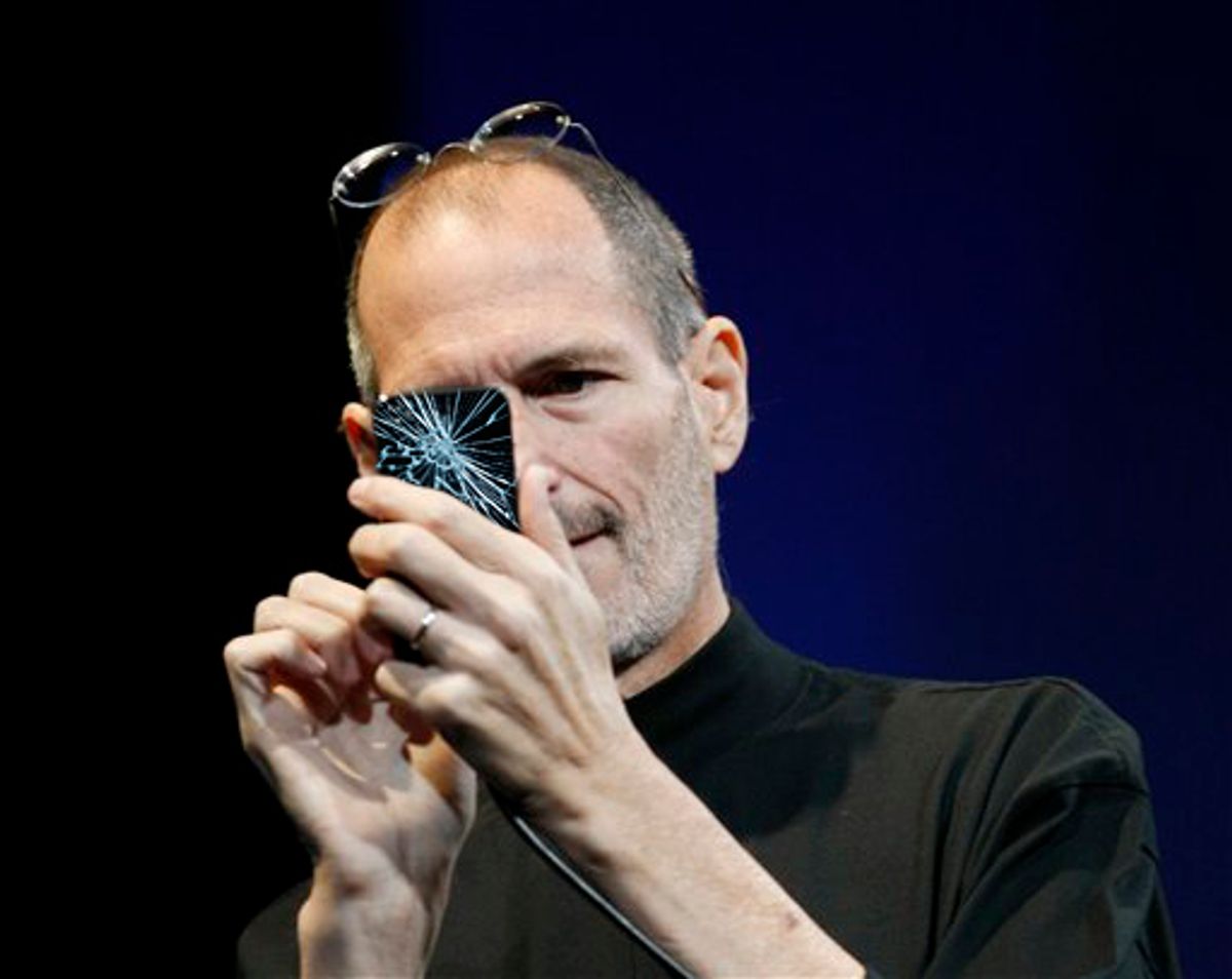 Apple CEO Steve Jobs uses the new iPhone during the Apple Worldwide Developers Conference, Monday, June 7, 2010, in San Francisco. (AP Photo/Paul Sakuma) (Paul Sakuma)