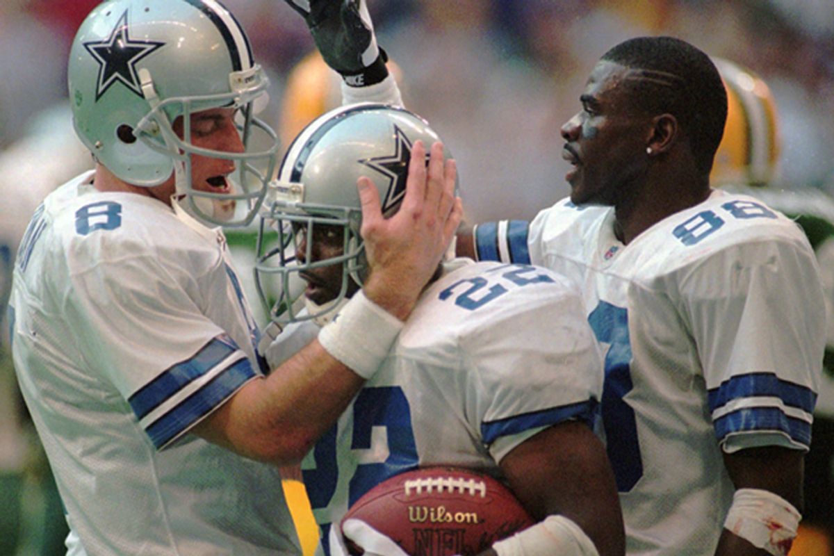 Troy Aikman, Emmitt Smith and Michael Irvin celebrate Smith's second-quarter touchdown run in the NFC Championship game against the Green Bay Packers on Jan. 14, 1996.