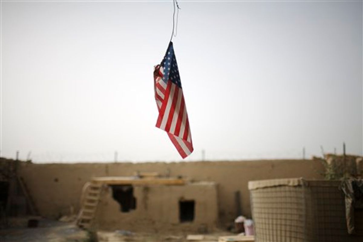 A U.S. flag hangs from the roof of  COP Nolen, in the volatile Arghandab Valley in Kandahar, Afghanistan, Saturday, July 24, 2010. (AP Photo/Rodrigo Abd) (AP)