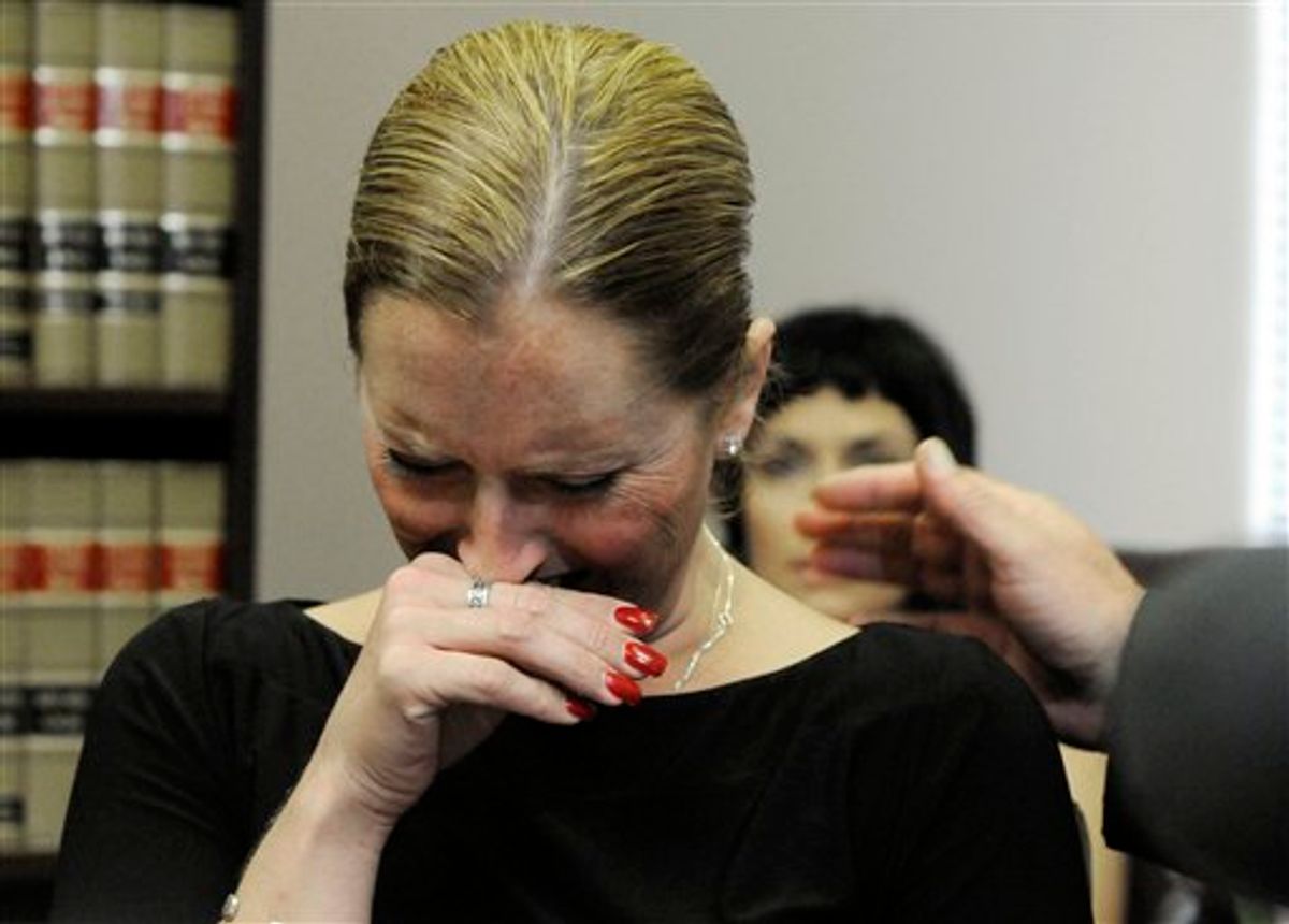 Nikki Araguz, transgender wife of a firefighter killed in the line of duty July 4, 2010, gets emotional during a press conference at her attorneys' office Thursday, July 22, 2010 in Houston. Relatives of Thomas Araguz are suing to keep her from getting benefits as Texas does not recognize same-sex weddings. (AP Photo/Pat Sullivan) (AP)
