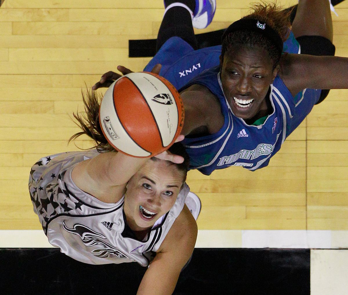 San Antonio Silver Spur's Becky Hammon, left, and Minnesota Lynx's Hamchetou Maiga-Ba, right, compete for a rebound during the fourth quarter of a WNBA basketball game, Saturday, June 26, 2010 in San Antonio. San Antonio won 80-66. (AP Photo/Eric Gay) (Eric Gay)