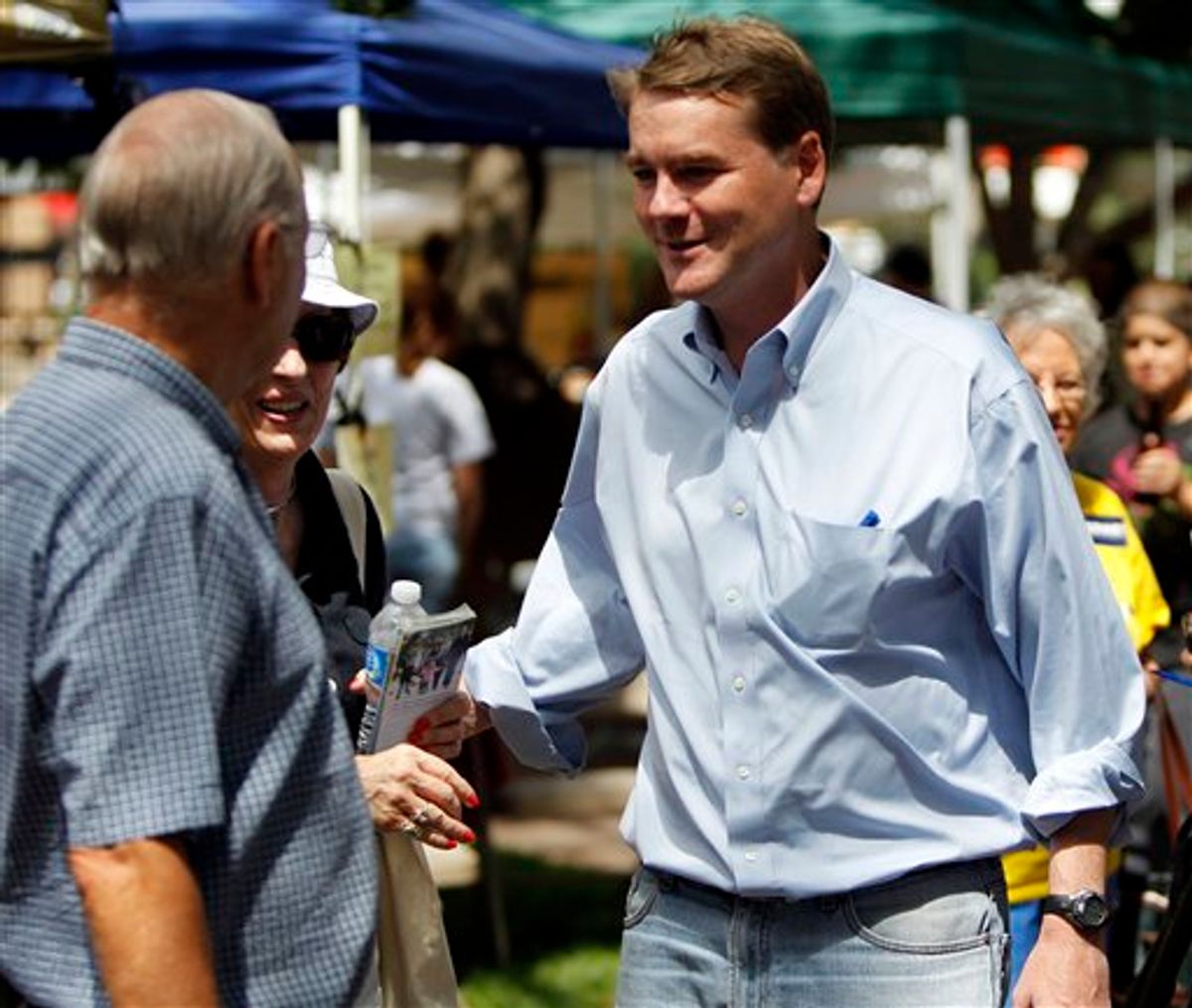 U.S. Senator Michael Bennet, right, D-Colo., campaigns in downtown Colorado Springs, Colo., on Monday, Aug. 9, 2010. Bennet is being challenged by former House Speaker Andrew Romanoff for his seat in the U.S. Senate in Tuesday's primary election. (AP Photo/Ed Andrieski) (AP)