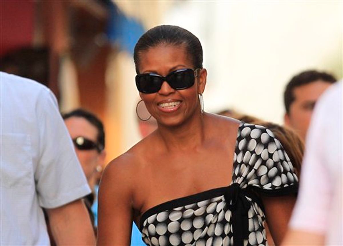 U.S. First Lady Michelle Obama smiles while she visits Marbella, southern Spain, Wednesday, Aug. 4, 2010. The White House says first lady Michelle Obama is in Spain for a private trip with longtime family friends. (AP Photo/Sergio Torres) (AP)