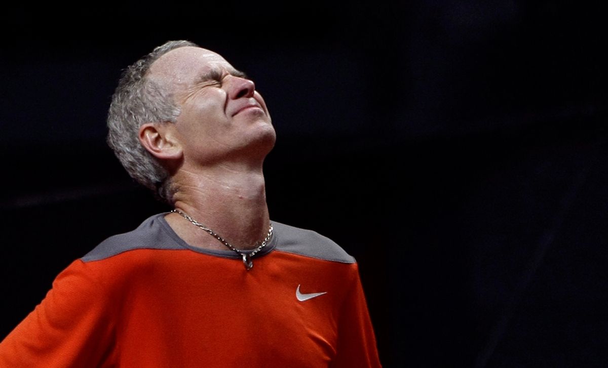 John McEnroe of U.S. gestures during his match against Sergi Bruguera of Spain at the Masters Senior tennis tournament in Madrid March 29, 2008. REUTERS/Juan Medina (SPAIN)     (Â© Juan Medina / Reuters)