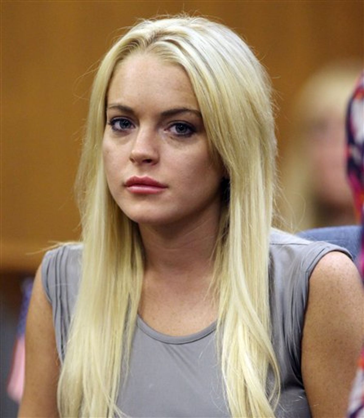 FILE - In this July 20, 2010 file photo, Lindsay Lohan is shown in court in Beverly Hills, Calif., where she was taken into custody to serve a jail sentence for probation violation. (AP Photo/Al Seib, file) (AP)