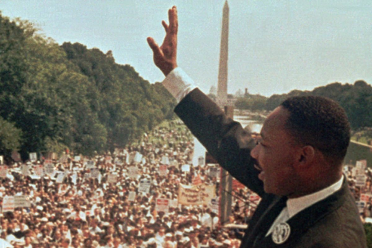 Martin Luther King Jr. acknowledges the crowd at the Lincoln Memorial for his "I Have a Dream" speech during the March on Washington on Aug. 28, 1963.       