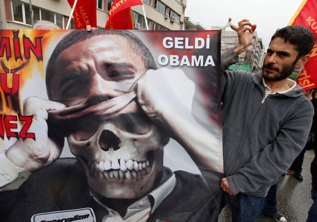 Demonstrators hold an anti-U.S. President Barack Obama poster during protests in downtown Ankara April 6, 2009. Obama is visiting Turkey on the last leg of an eight-day trip that marks his debut as president on the world stage, is a recognition of the secular but predominantly Muslim country's growing clout and Washington's desire for its help to solve confrontations and conflicts from Iran to Afghanistan. REUTERS/Pawel Kopczynski (TURKEY POLITICS CONFLICT) (Â© Pawel Kopczynski / Reuters)