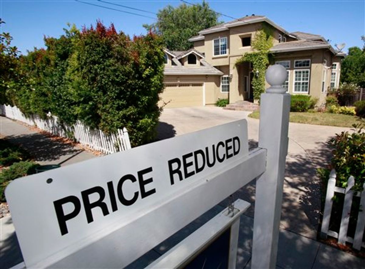 A home for sale is posted at a reduced price in Palo Alto, Calif., Thursday, June 24, 2010. Mortgage rates fell this week to the lowest level on record, giving consumers added incentive to lock in low payments for home purchases and refinanced loans. (AP Photo/Paul Sakuma)  (AP)