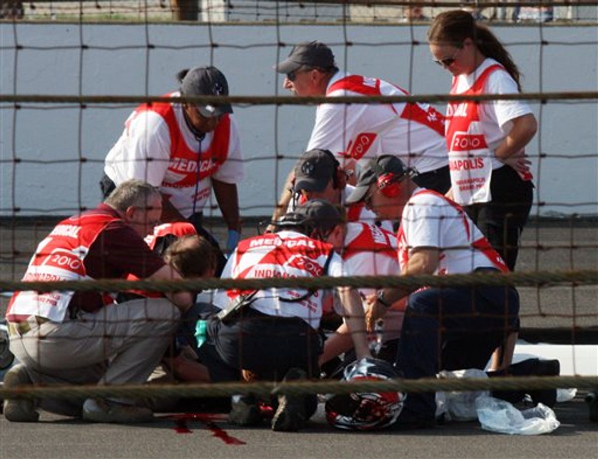 ** EDS NOTE GRAPHIC CONTENT ** Peter Lenz, of Vancouver, Wash., is treated by medical personnel after a crash Sunday, Aug. 29, 2010, in a motorcycle race that took place before the MotoGP event at Indianapolis Motor Speedway in Indianapolis, Sunday, Aug. 29, 2010. Lenz fell off his bike and was run over by another motorcycle. He was pronounced dead later Sunday. (AP Photo/Jimmy Dawson) (AP)