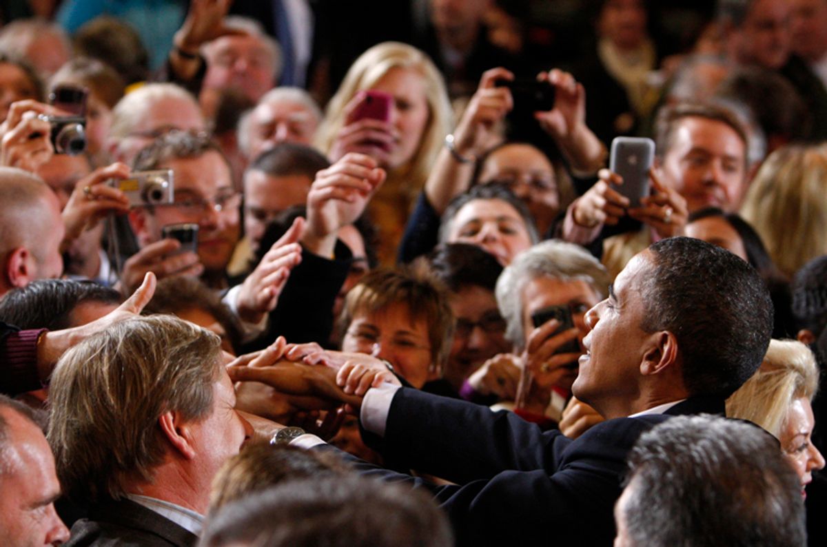 U.S. President Barack Obama greets supporters at a campaign rally for candidate for U.S. Senate Attorney General Martha Coakley at Northeastern University in Boston, January 17, 2010.   REUTERS/Jim Young    (UNITED STATES - Tags: POLITICS) (Â© Jim Young / Reuters)
