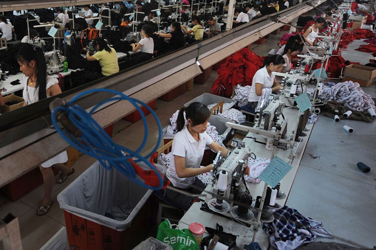Employees work at a garment factory in Wuhu, Anhui province, on August 1.