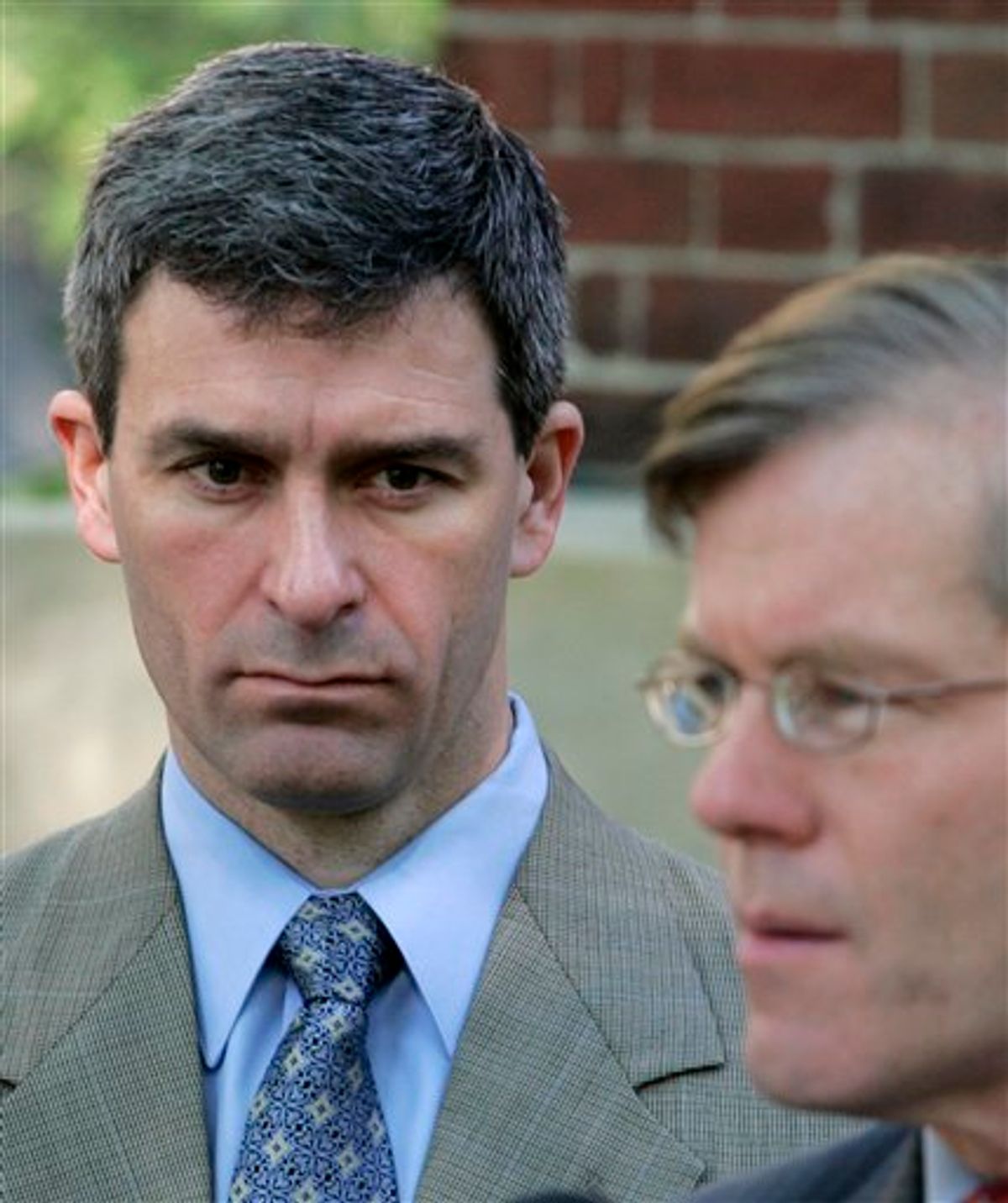 Virginia Attorney General Ken Cuccinelli, left, listens as Gov. Bob McDonnell speaks during a ceremony on Friday, April 16, 2010 at the Capitol in Richmond, Va., marking the third anniversary of the shootings at Virginia Tech, where 32 people plus the shooter died. (AP Photo/Steve Helber)           (AP)